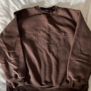 brown calabasas crewneck from white fox boutique. size S/M